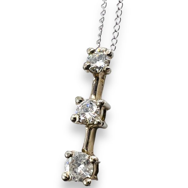 Vertical bar diamond pendant.